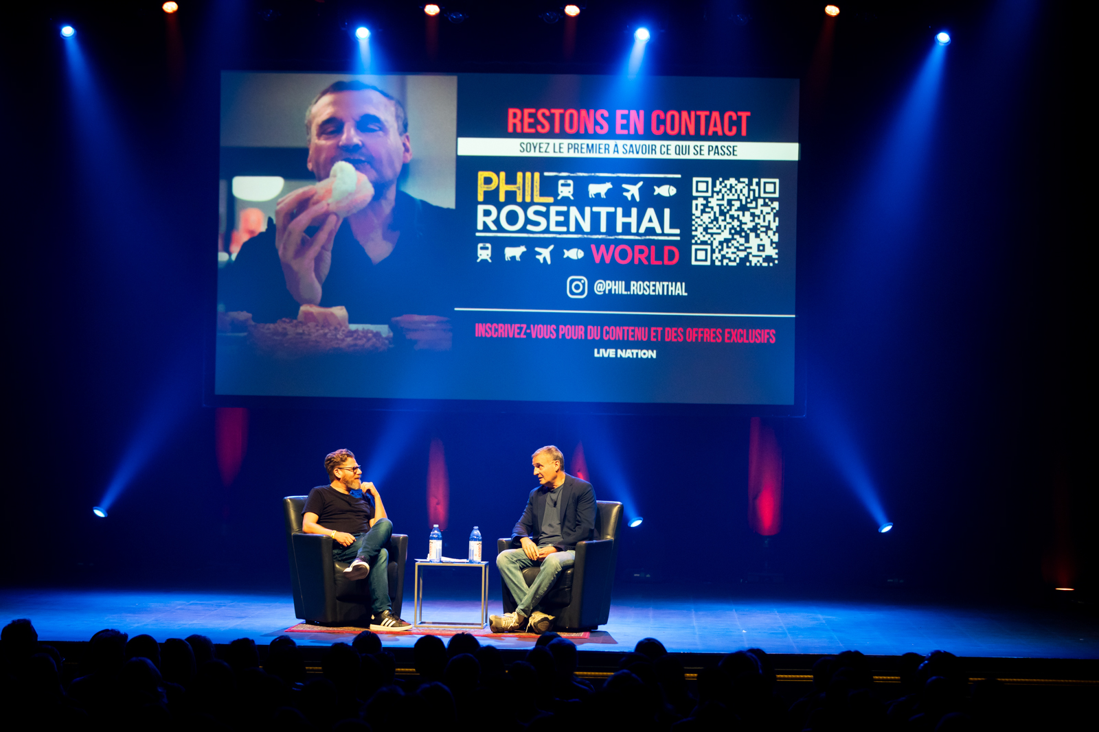 Eric Cohen interviewing Phil Rosenthal on stage at Théâtre Olympia